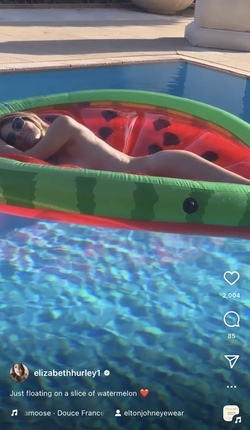 Liz Hurley poses totally nude on a slice of watermelon Liz Hurley poses totally nude on a slice of watermelon