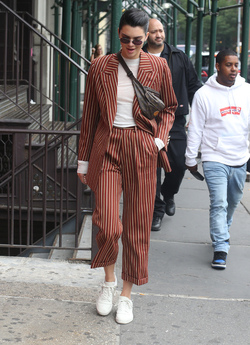 Kendall Jenner Accessorizes a Striped Suit with a Louis Vuitton Fanny Pack Kendall Jenner Accessorizes a Striped Suit with a Louis Vuitton Fanny Pack