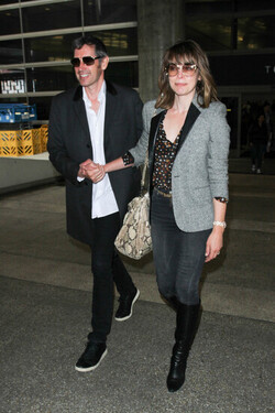 Milla Jovovich and Paul Anderson pictured at Los Angeles International Airport Milla Jovovich and Paul Anderson pictured at Los Angeles International Airport