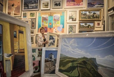 Sophie Miller of the Llewellyn Alexander gallery in Waterloo sifts through the approximately 600 works of art that has been rejected from the annual prestigious Royal Academy exhibition Sophie Miller of the Llewellyn Alexander gallery in Waterloo sifts through the approximately 600 works of art that has been rejected from the annual prestigious Royal Academy exhibition