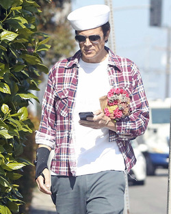 Johnny Knoxville Accesorizes with Sailor Hat and Wrist Brace