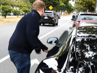 James Corden was spotted in Brentwood climbing into his Aston Martin Rapide sportscar.