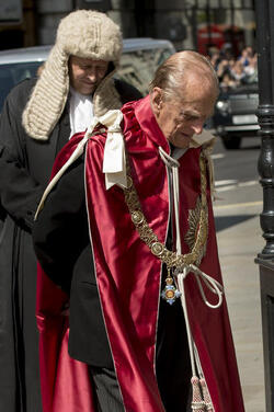 Queen Elizabeth II and Prince Philip Duke of Edinburgh attend a service to mark the 100th anniversary of the Order of the British Empire at St Paul s Cathedral in London.