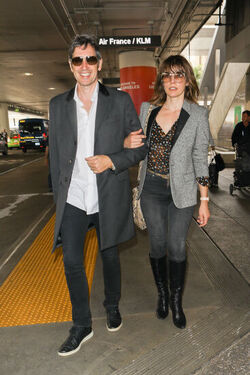 Milla Jovovich and husband director Paul W. S. Anderson were spotted returning to Los Angeles at LAX.