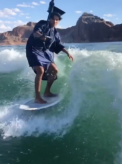 HIGH SCHOOL GRADUATE TAKES UNIQUE GRADUATION PHOTOS WHILE WAKESURFING